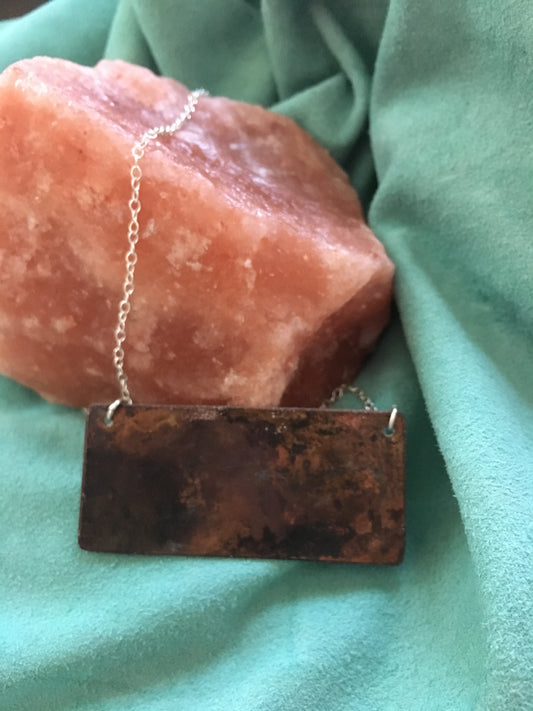 Harlequin Black and White enamel pendant with red and blue hearts